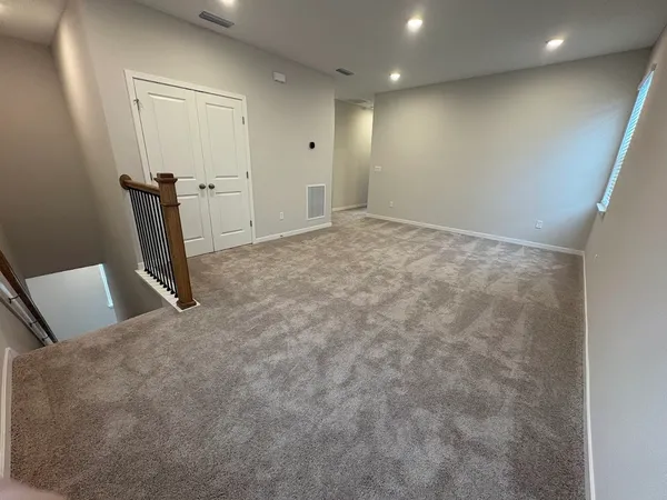 a view of a livingroom with wooden floor