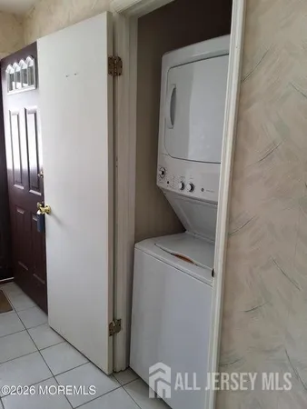 a bathroom with a sink a mirror and a potted plant