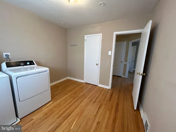 a view of a storage & utility room with a washer dryer