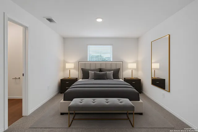 a bedroom with a bed and window