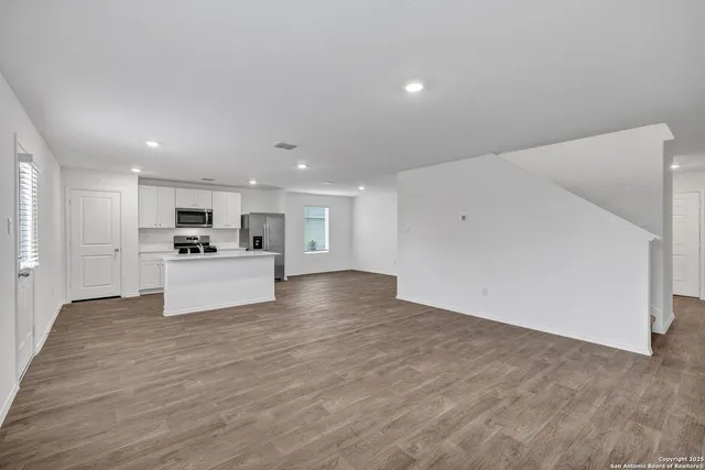 a view of kitchen with wooden floor