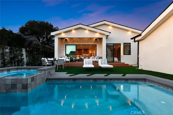 a view of a house with backyard porch and patio