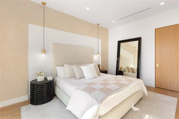 a bedroom with a bed and a balcony