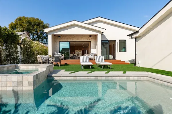 a view of a swimming pool with a patio