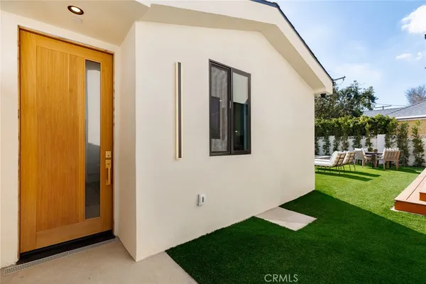 a kitchen with stainless steel appliances kitchen island granite countertop a refrigerator and a sink