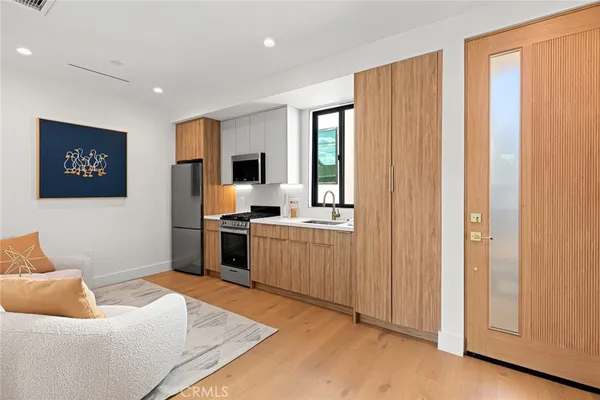 a view of a livingroom with furniture and washing machine