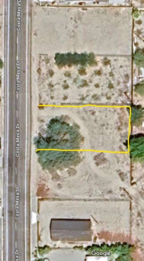 5 Costa Mesa Drive Mecca, CA 92254 - Photo 1 of 2 a room with a floor to ceiling window and outdoor view