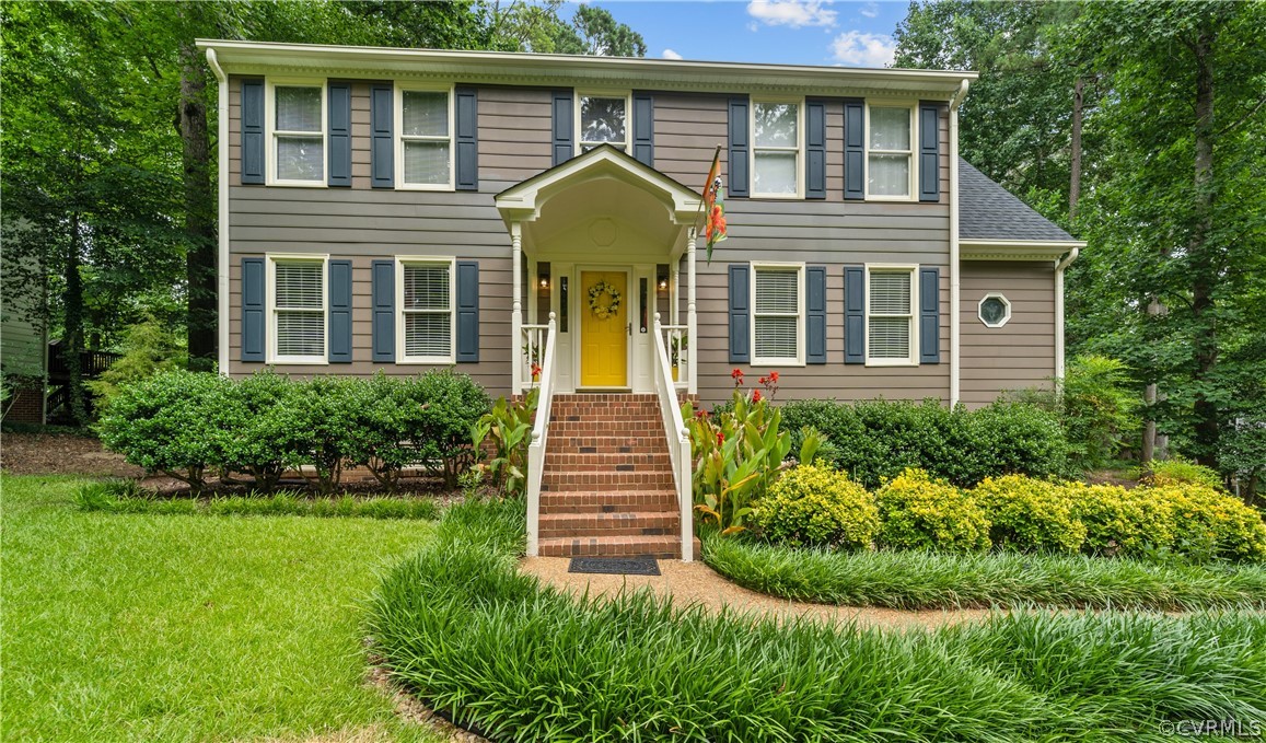 a front view of a house with a yard
