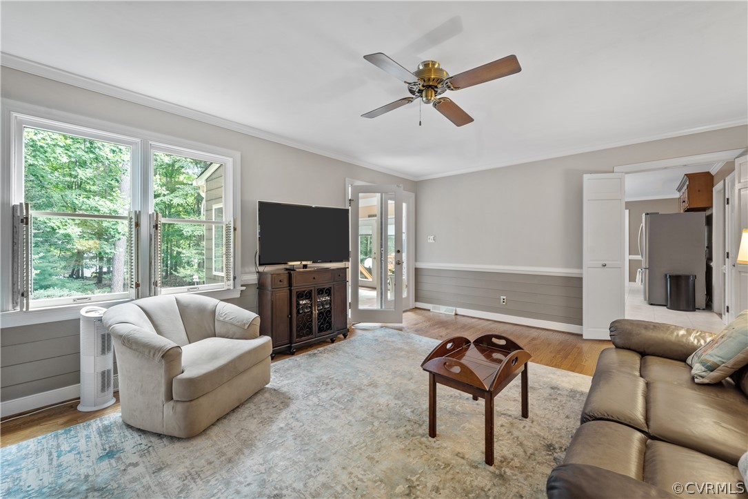 5609 North Chase Road Midlothian, VA 23112 - Photo 11 of 43 a living room with furniture and a flat screen tv