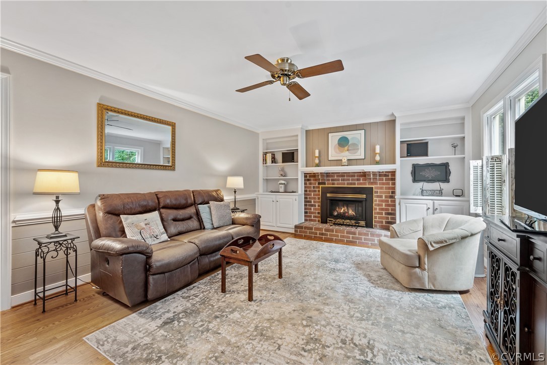 5609 North Chase Road Midlothian, VA 23112 - Photo 12 of 43 a living room with furniture and a fireplace