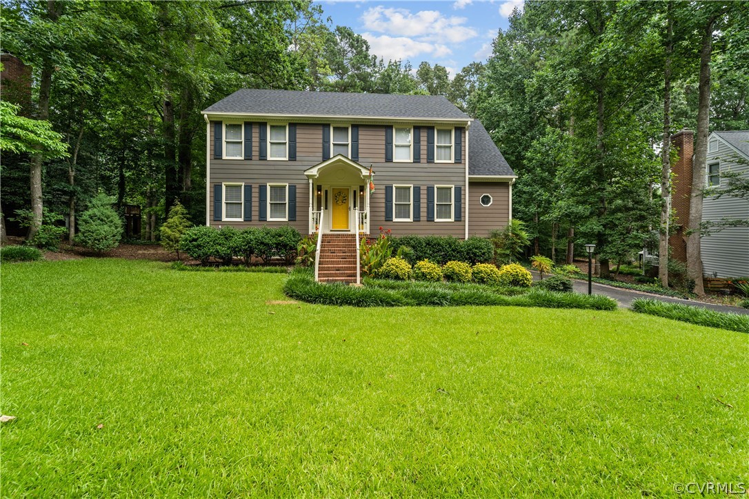 5609 North Chase Road Midlothian, VA 23112 - Photo 2 of 43 a front view of a house with a yard