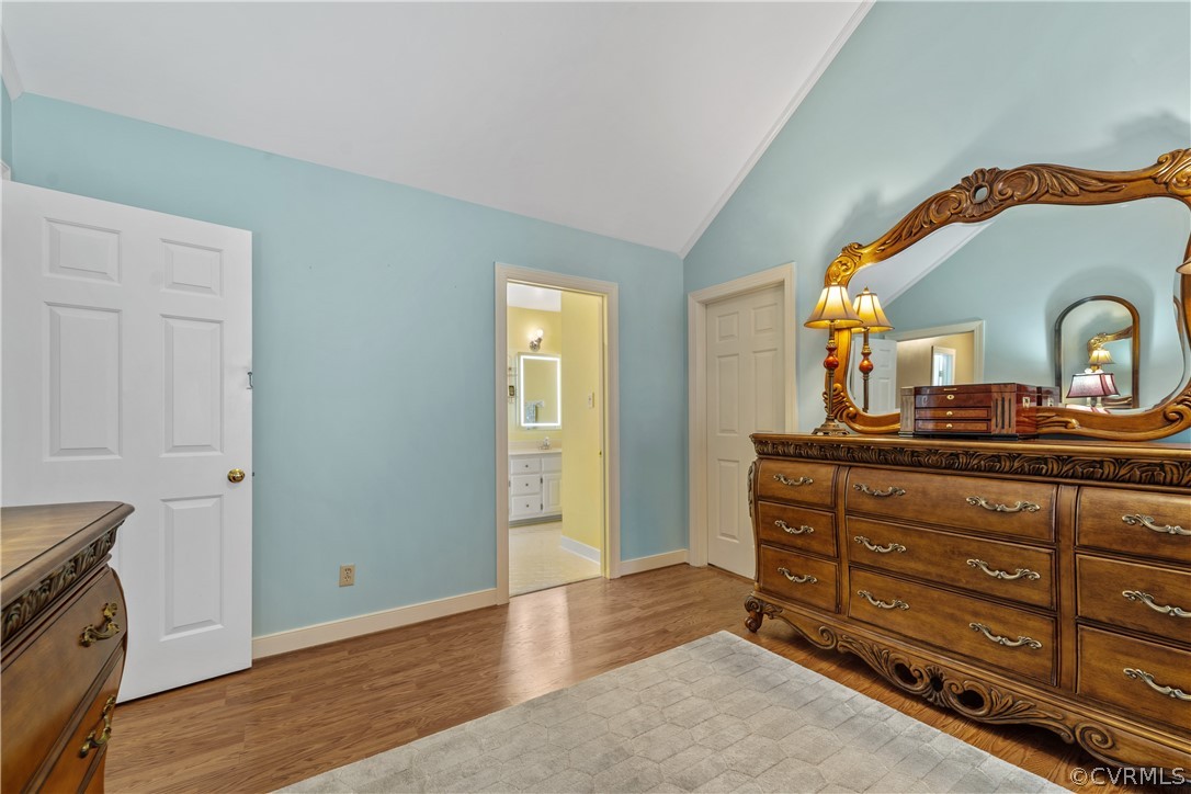 5609 North Chase Road Midlothian, VA 23112 - Photo 22 of 43 a room with a dresser and a mirror