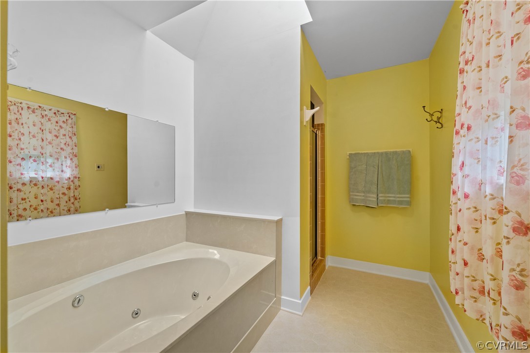 5609 North Chase Road Midlothian, VA 23112 - Photo 24 of 43 a bathroom with a bathtub and shower