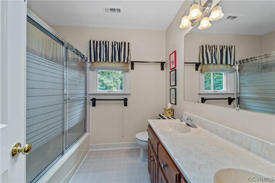 5609 North Chase Road Midlothian, VA 23112 - Photo 31 of 43 a bathroom with a sink a toilet and shower