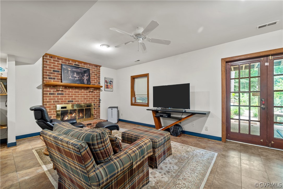 5609 North Chase Road Midlothian, VA 23112 - Photo 33 of 43 a living room with furniture and a flat screen tv