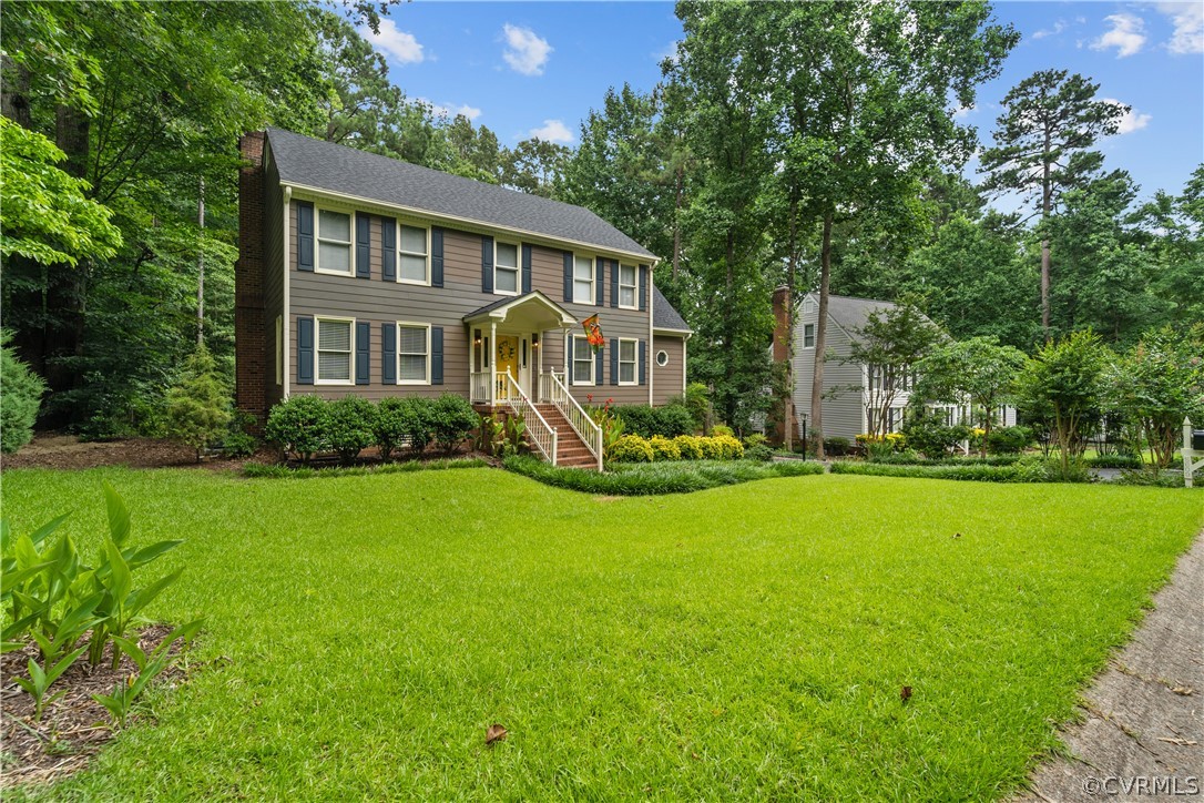 5609 North Chase Road Midlothian, VA 23112 - Photo 41 of 43 a front view of house with yard and green space
