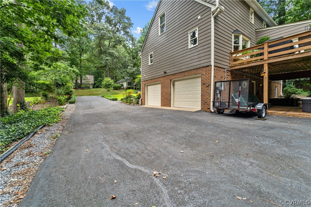 5609 North Chase Road Midlothian, VA 23112 - Photo 43 of 43 a view of a house with a patio and a yard