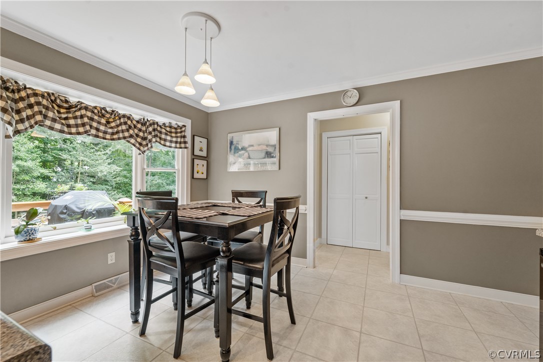 5609 North Chase Road Midlothian, VA 23112 - Photo 8 of 43 a view of a dining room with furniture window and outside view