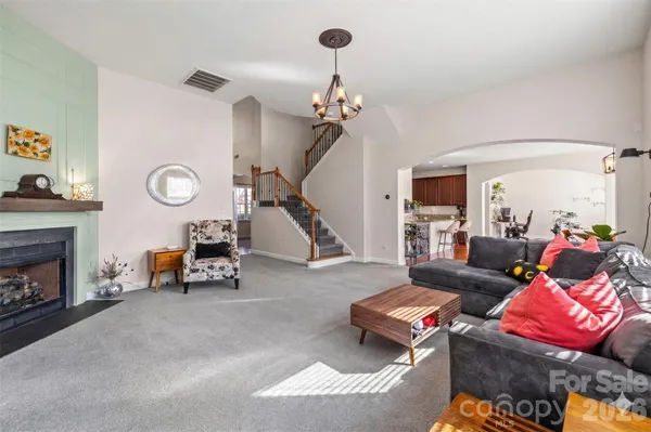 a living room with furniture and a fireplace