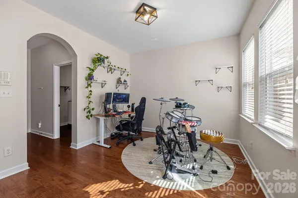 a view of a workspace with furniture and a bedroom