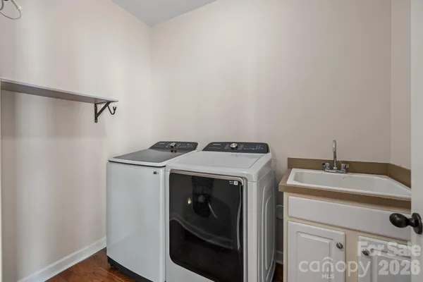 a utility room with dryer and washer