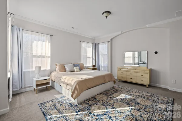 a bed room with a bed and a window