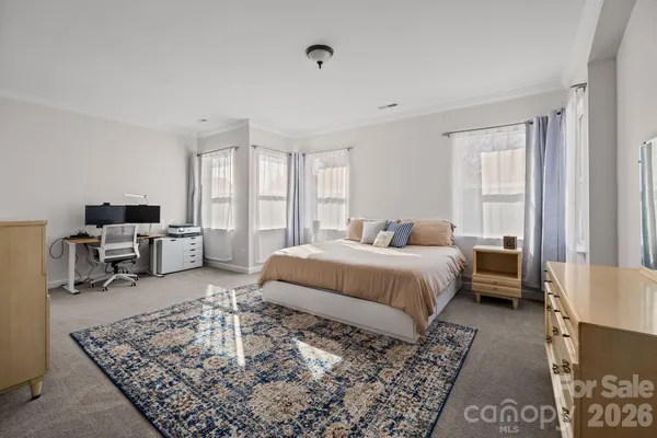 a bed room with a bed and a couch