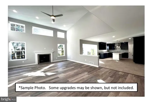 a view of kitchen and kitchen with furniture wooden floor