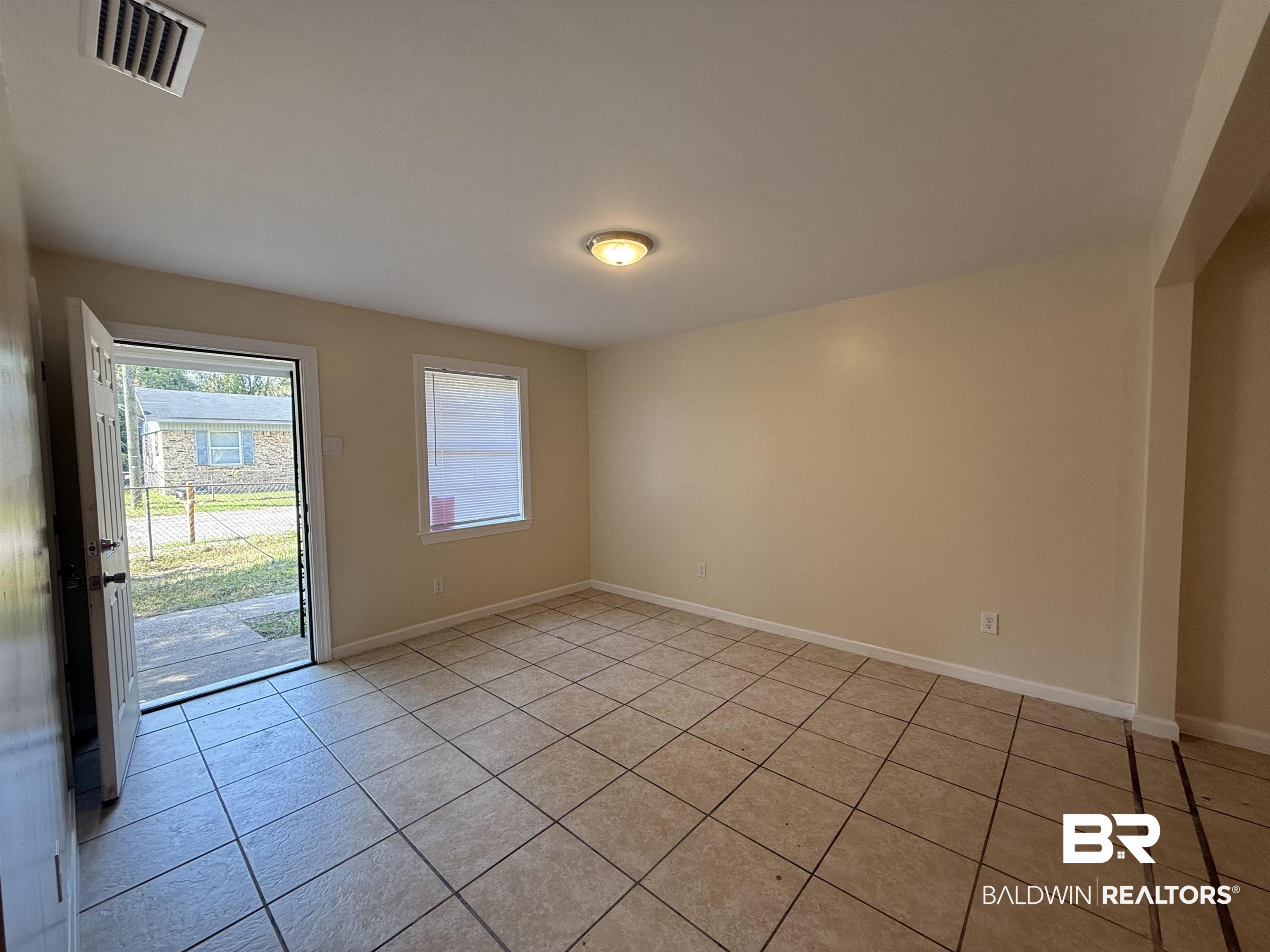 320 E Street Prichard, AL 36610 - Photo 16 of 16 Unfurnished room featuring light tile patterned floors