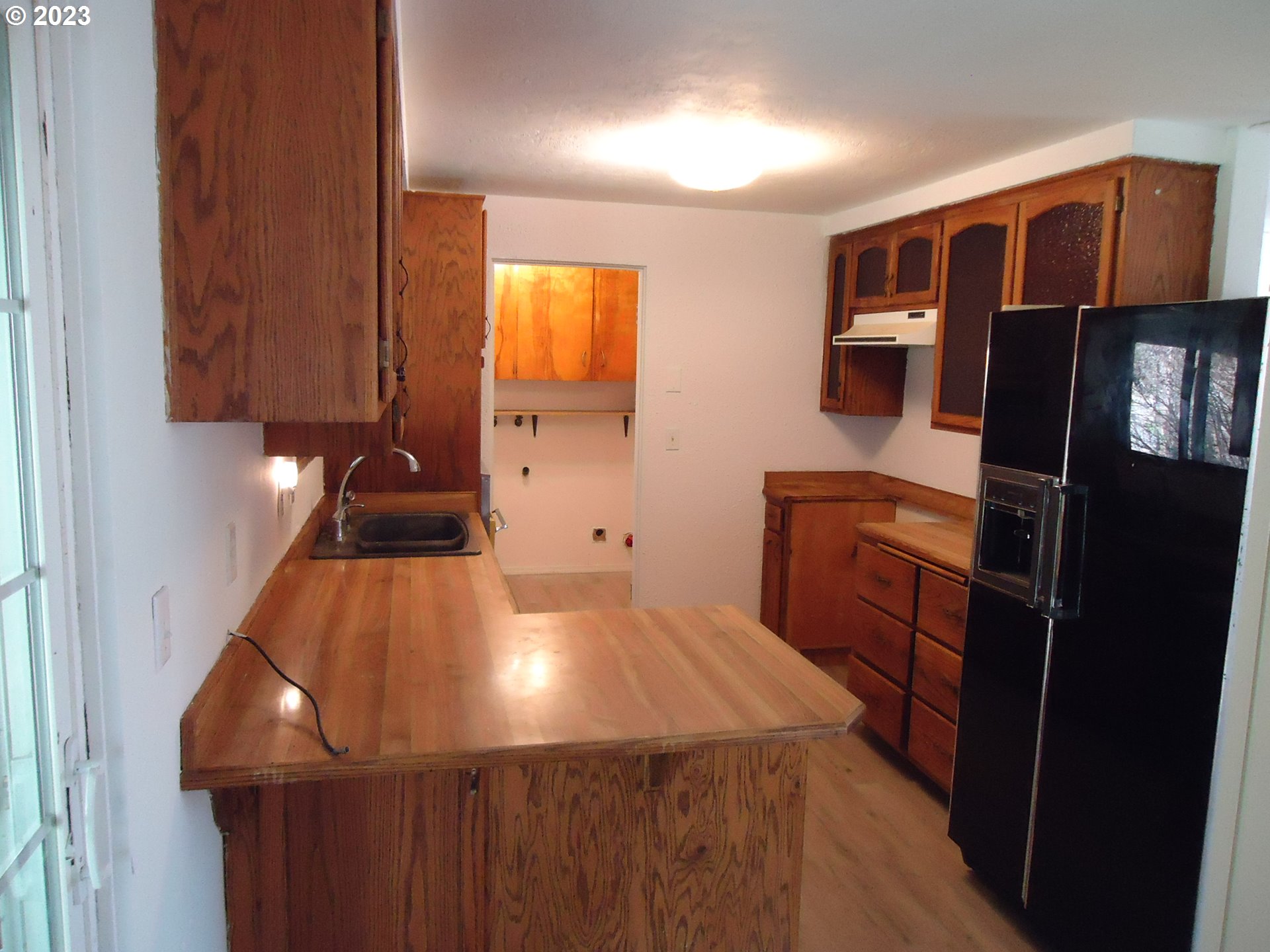 954 Quinalt Street Springfield, OR 97477 - Photo 6 of 18 a kitchen with a sink and cabinets