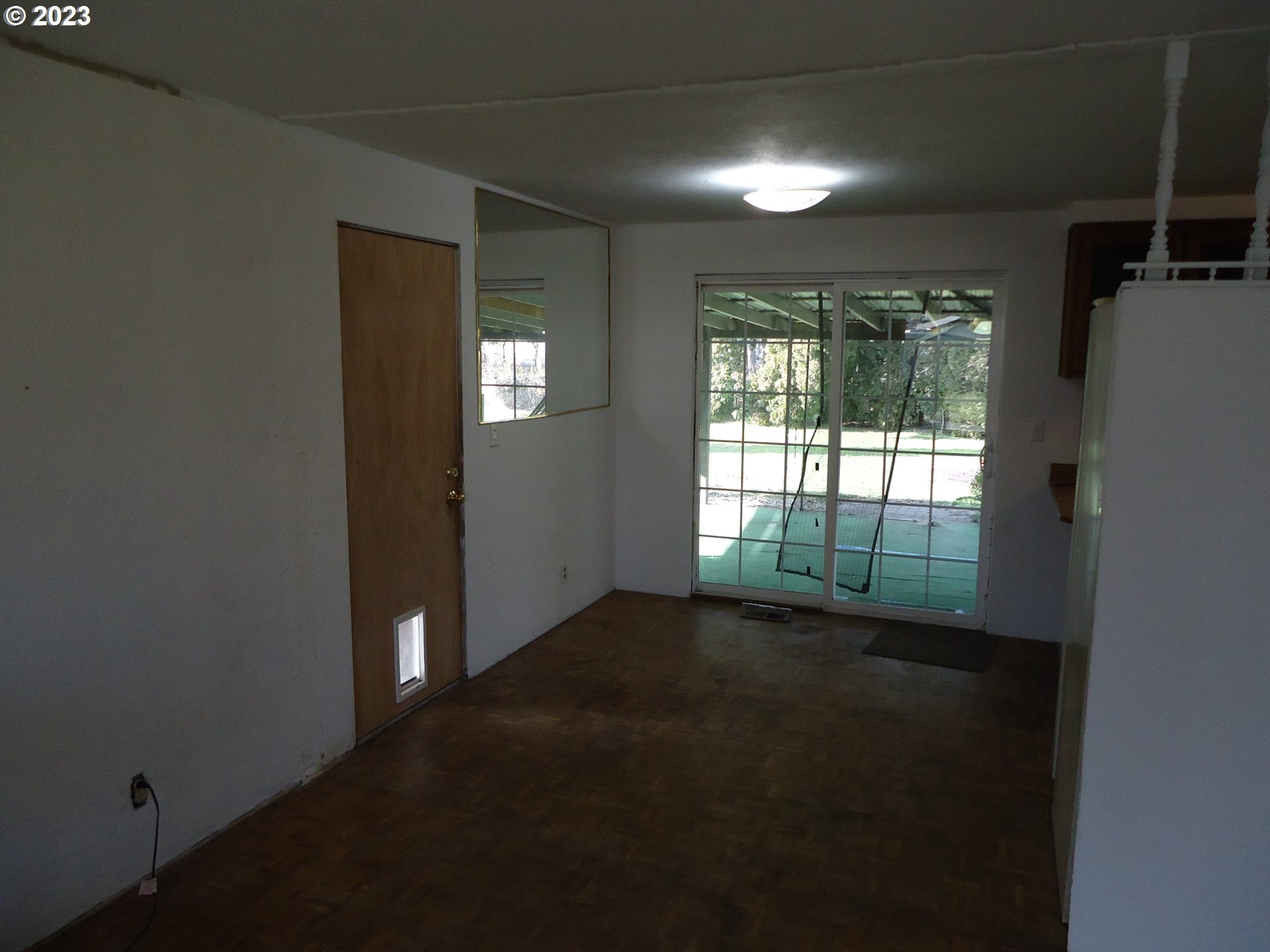 954 Quinalt Street Springfield, OR 97477 - Photo 8 of 18 a view of empty room with floor to ceiling window