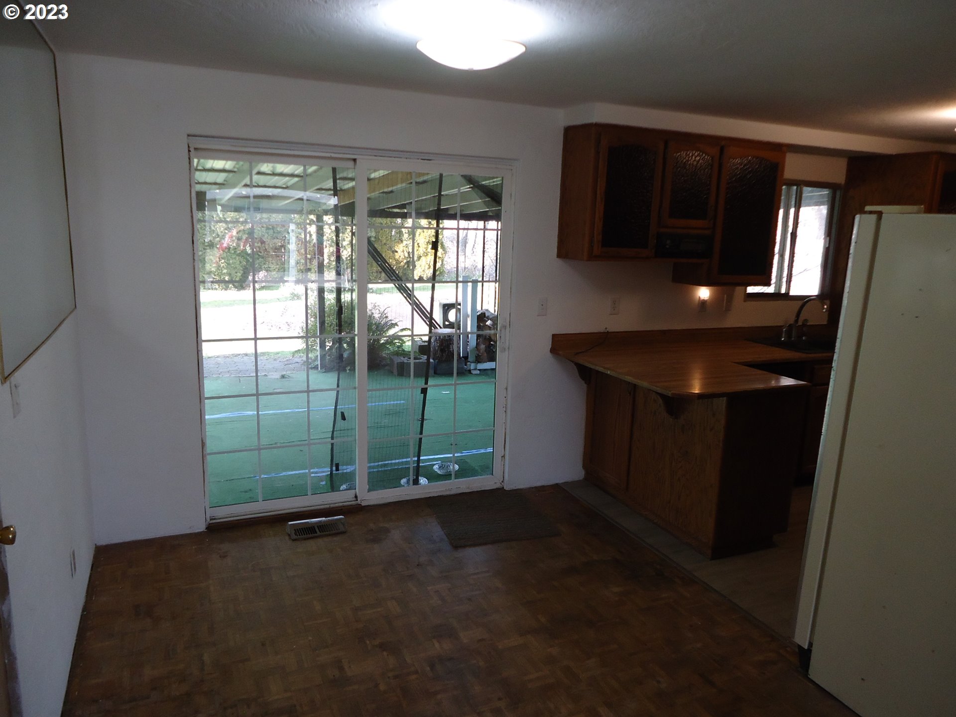 954 Quinalt Street Springfield, OR 97477 - Photo 9 of 18 a living room with hardwood floor and a sink