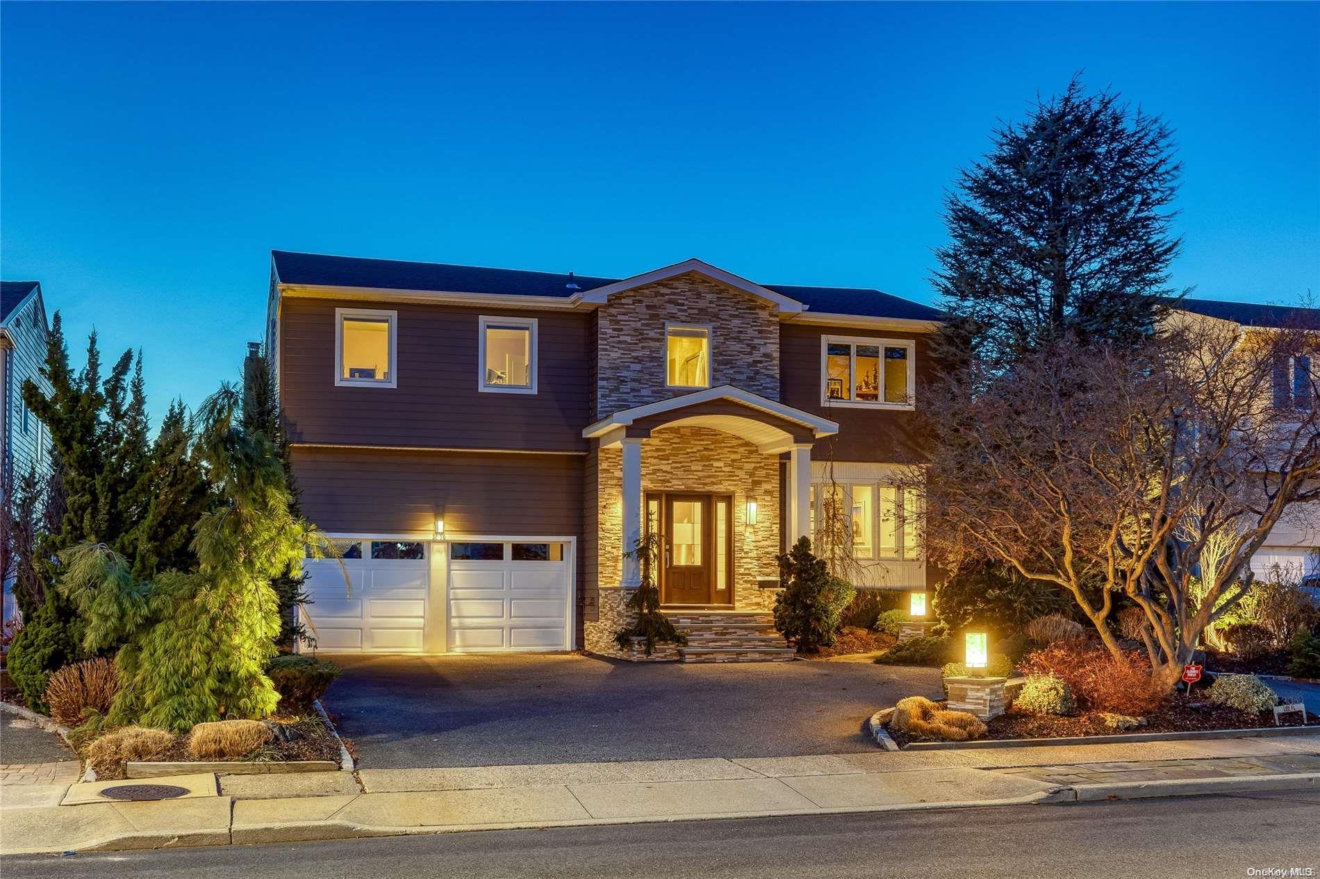 3030 Lee Place Bellmore, NY 11710 - Photo 1 of 1 a front view of a house with a yard