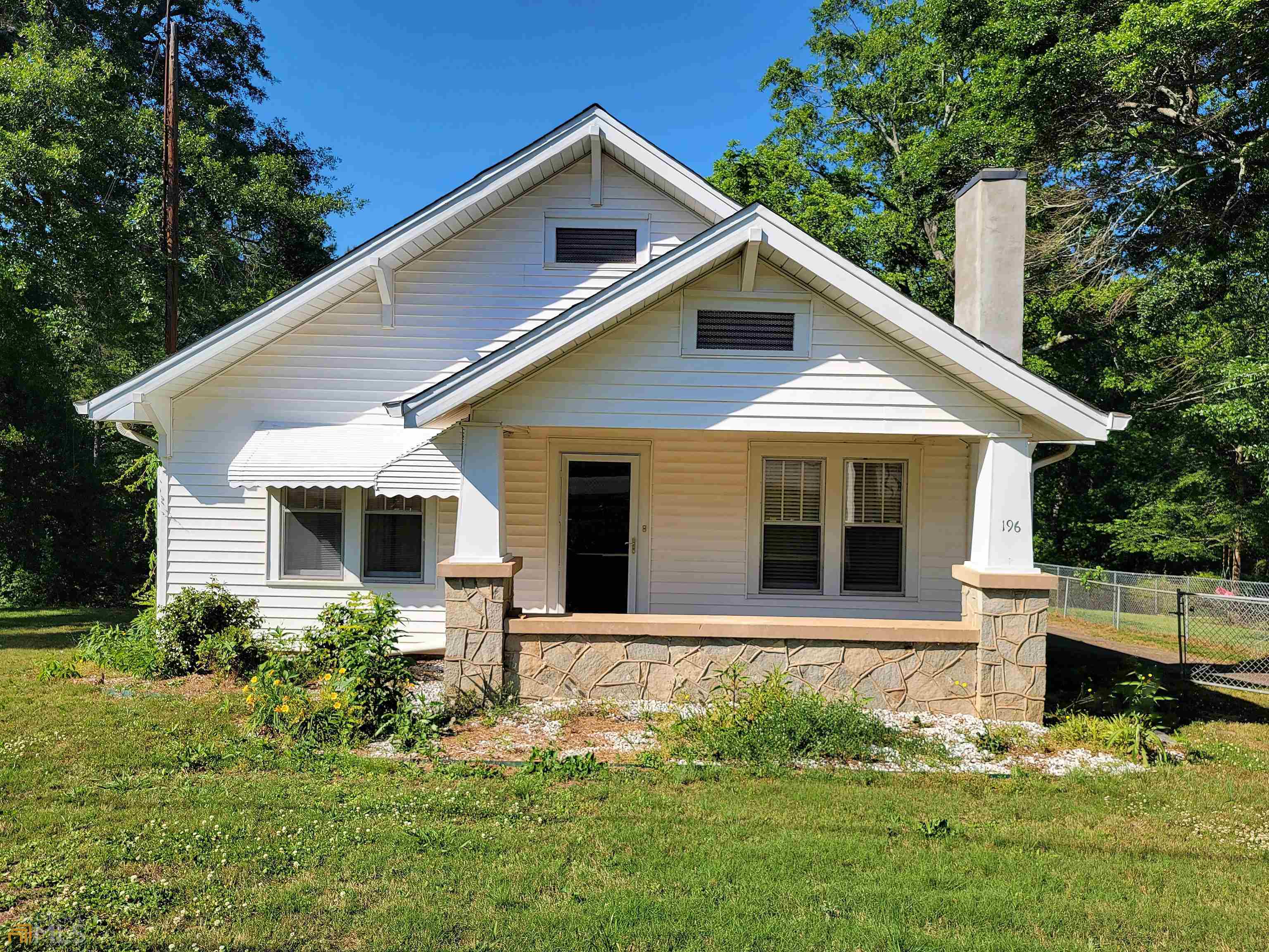 196 Baugh Street Commerce, GA 30529 - Photo 1 of 1 a front view of house with yard and green space