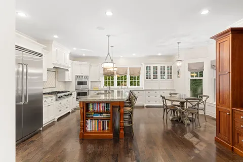 a kitchen with lots of counter top space and stainless steel appliances