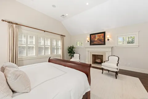 a bedroom with a bed and a chair