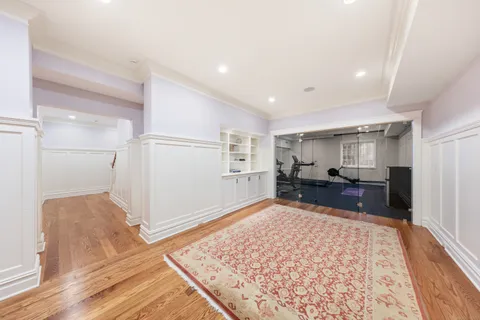 a living room with furniture and a rug