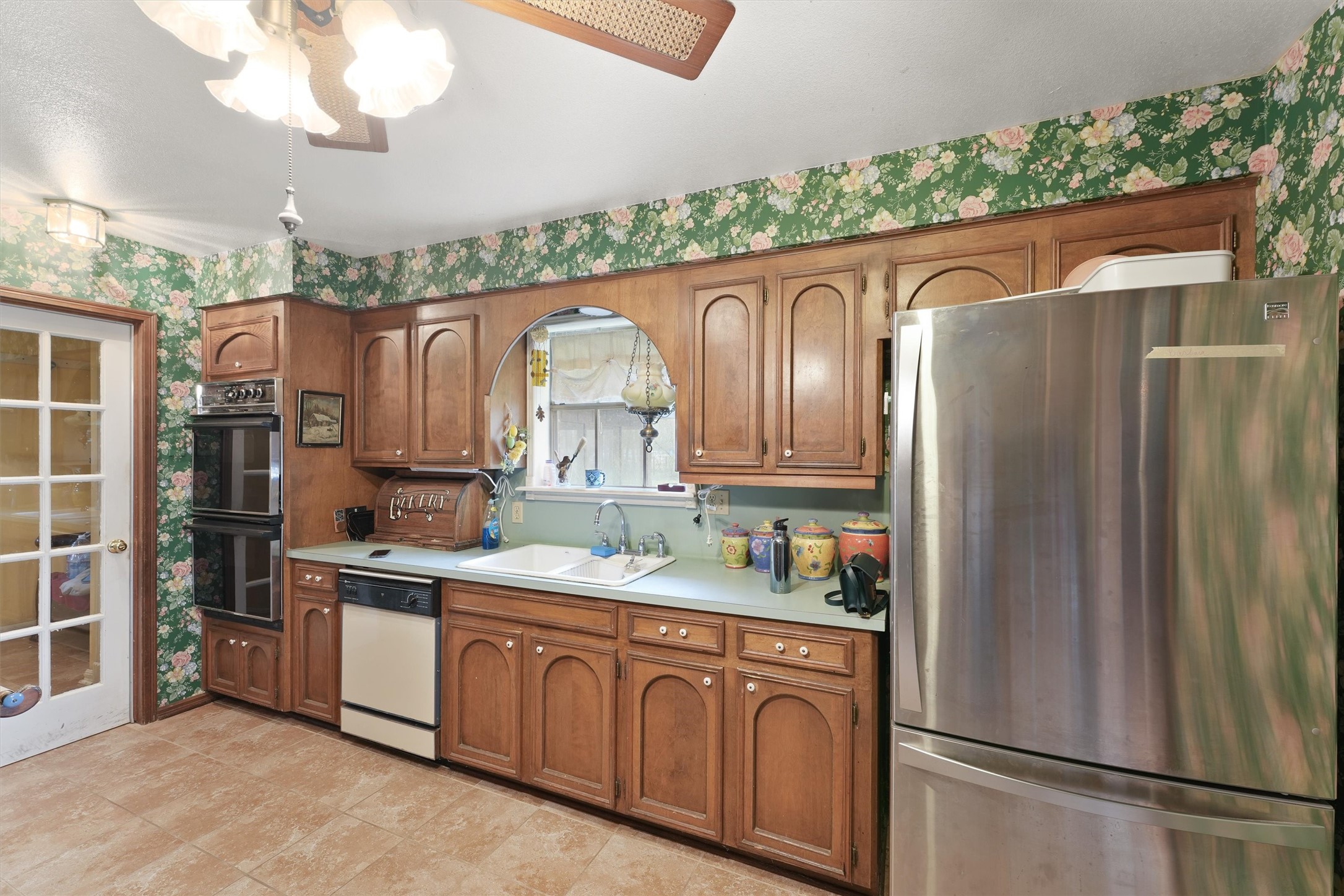 31926 Dobbin-Huffsmith Road Magnolia, TX 77354 - Photo 12 of 47 a kitchen with stainless steel appliances granite countertop a refrigerator and a sink
