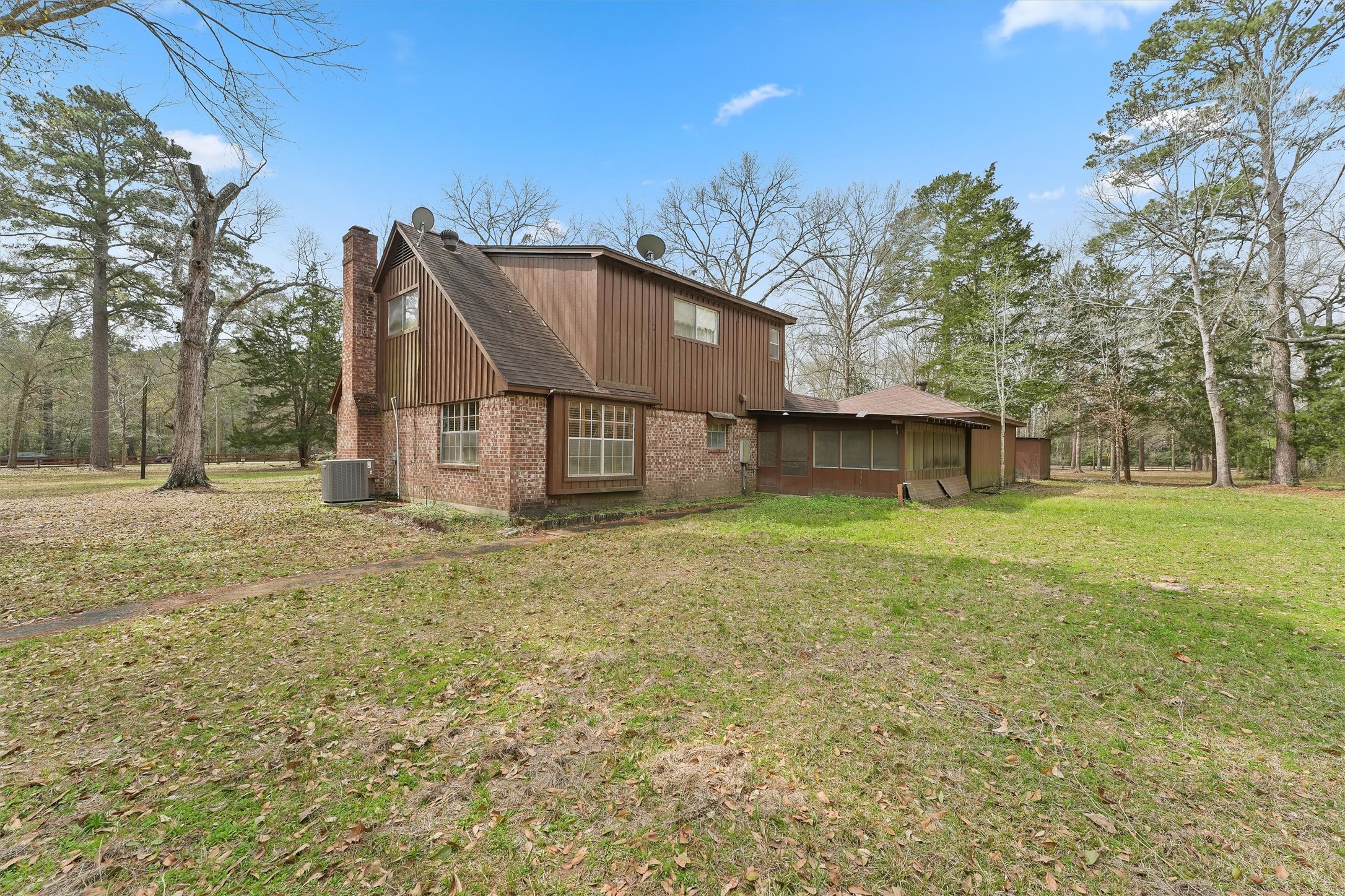 31926 Dobbin-Huffsmith Road Magnolia, TX 77354 - Photo 18 of 47 a view of a house with a yard