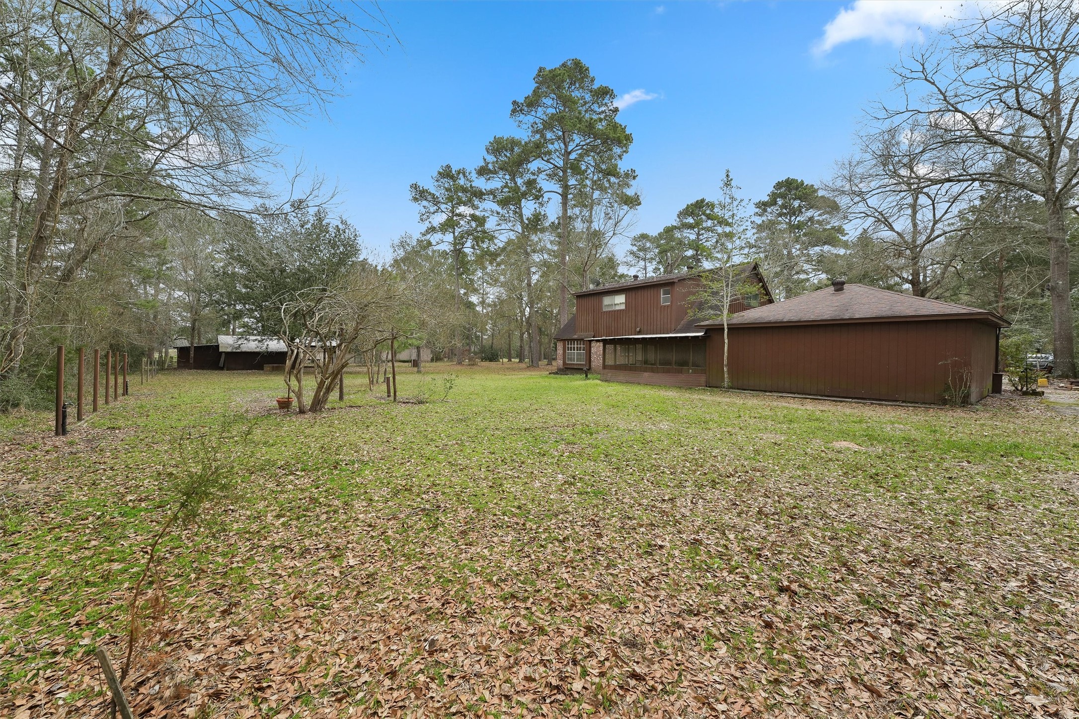 31926 Dobbin-Huffsmith Road Magnolia, TX 77354 - Photo 30 of 47 a backyard of a house with lots of green space