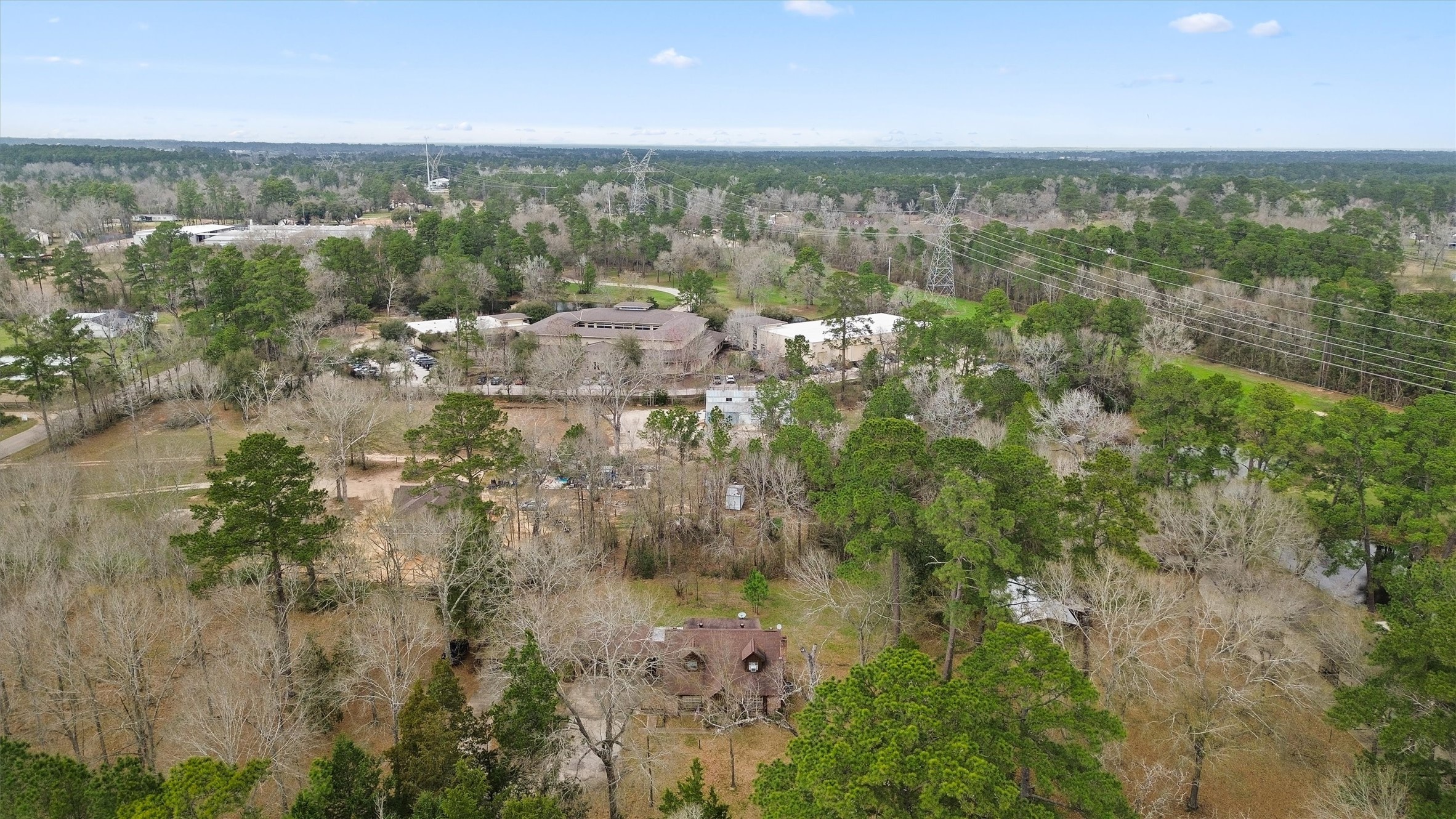 31926 Dobbin-Huffsmith Road Magnolia, TX 77354 - Photo 42 of 47 an aerial view of residential houses with outdoor space and trees