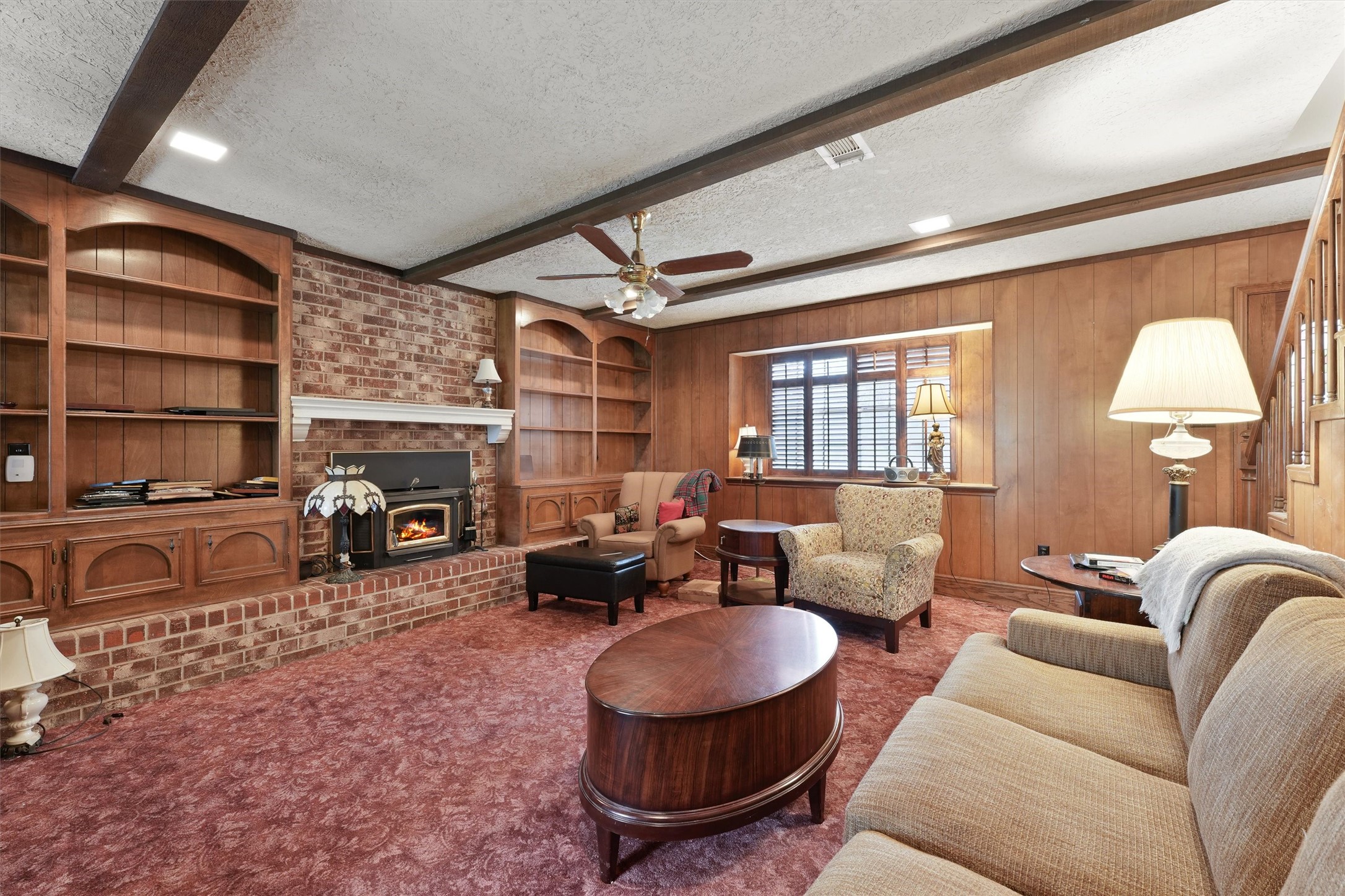 31926 Dobbin-Huffsmith Road Magnolia, TX 77354 - Photo 6 of 47 a living room with furniture a fireplace and a flat screen tv