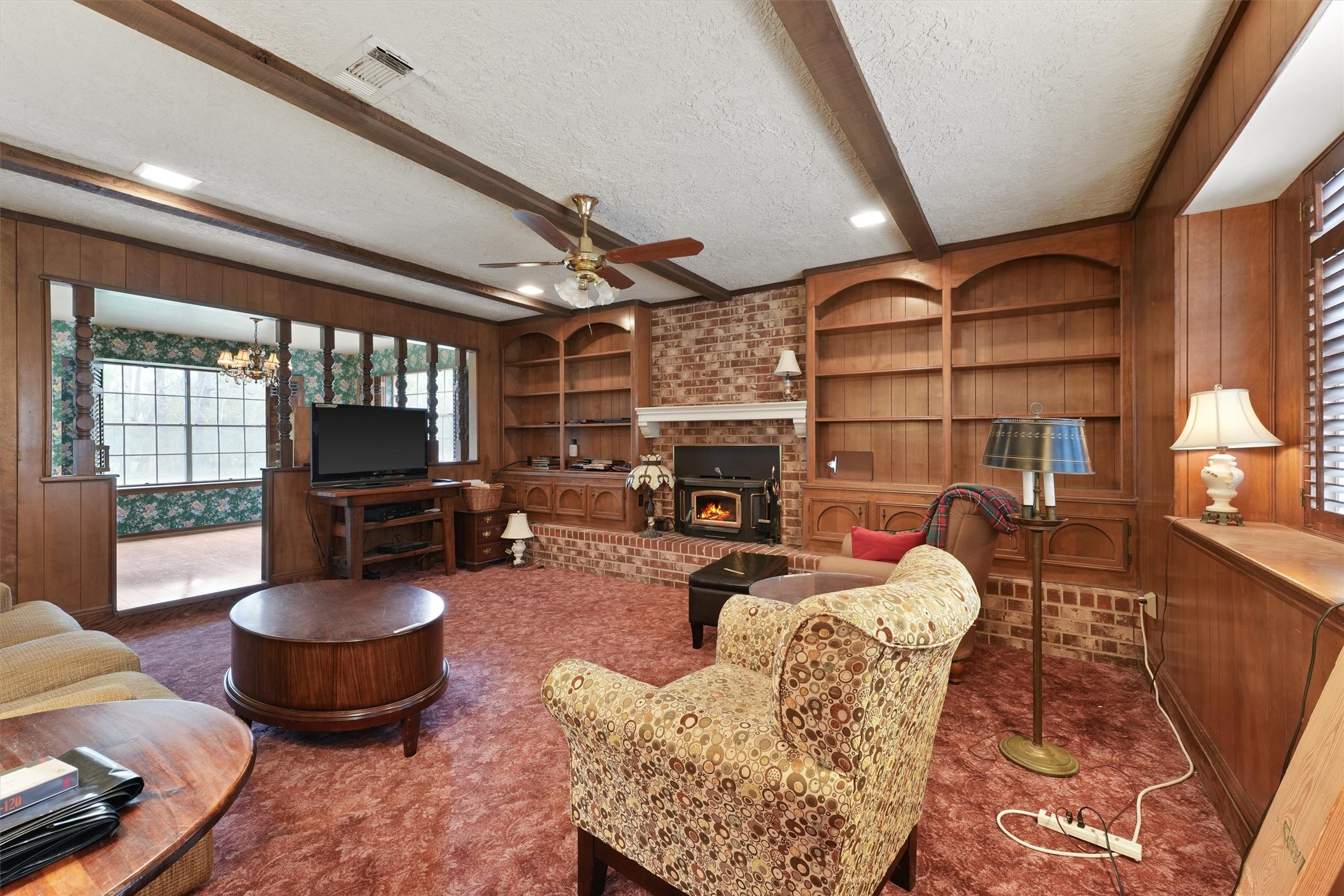 31926 Dobbin-Huffsmith Road Magnolia, TX 77354 - Photo 7 of 47 a living room with furniture a flat screen tv and a fireplace
