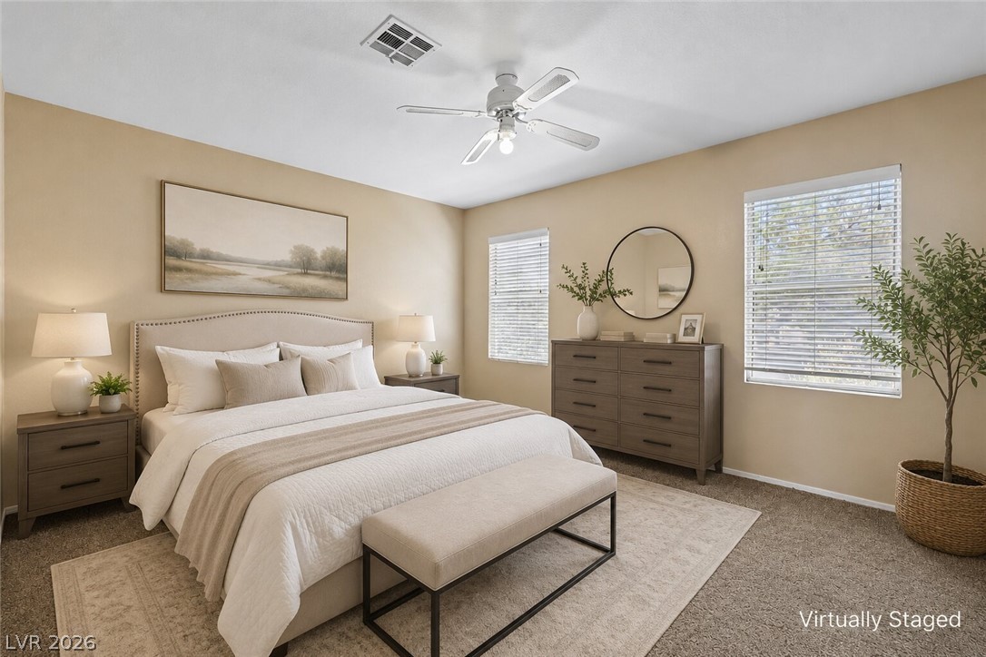 1727 Millstream Way Henderson, NV 89074 - Photo 4 of 46 Unwind in a serene bedroom featuring plush carpeting and a light-filled ambiance, ideal for restful nights.