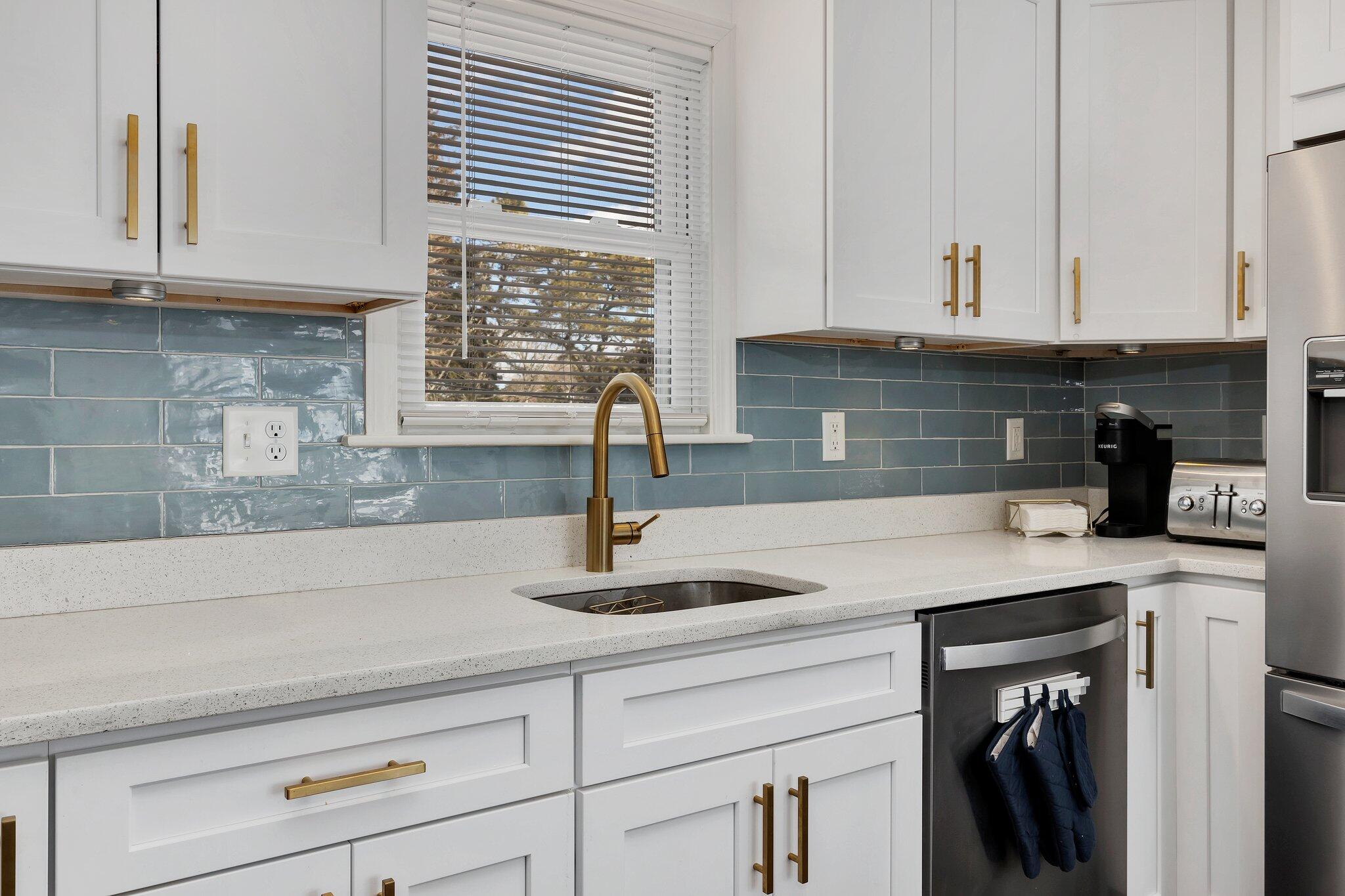 7 G Hideaway Road Buzzards Bay, MA 02532 - Photo 11 of 24 a kitchen with granite countertop a sink and cabinets