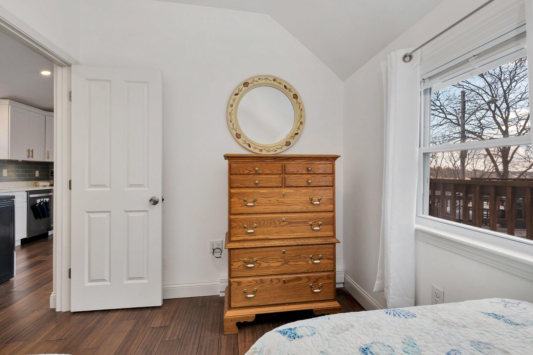 7 G Hideaway Road Buzzards Bay, MA 02532 - Photo 16 of 24 a bedroom with a bed and a mirror