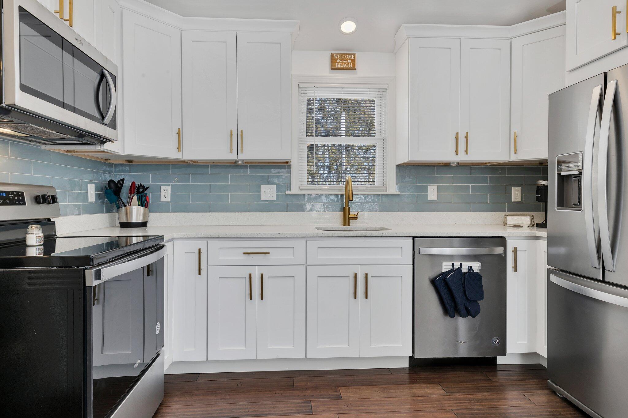 7 G Hideaway Road Buzzards Bay, MA 02532 - Photo 10 of 24 a kitchen with stainless steel appliances granite countertop a refrigerator sink and stove