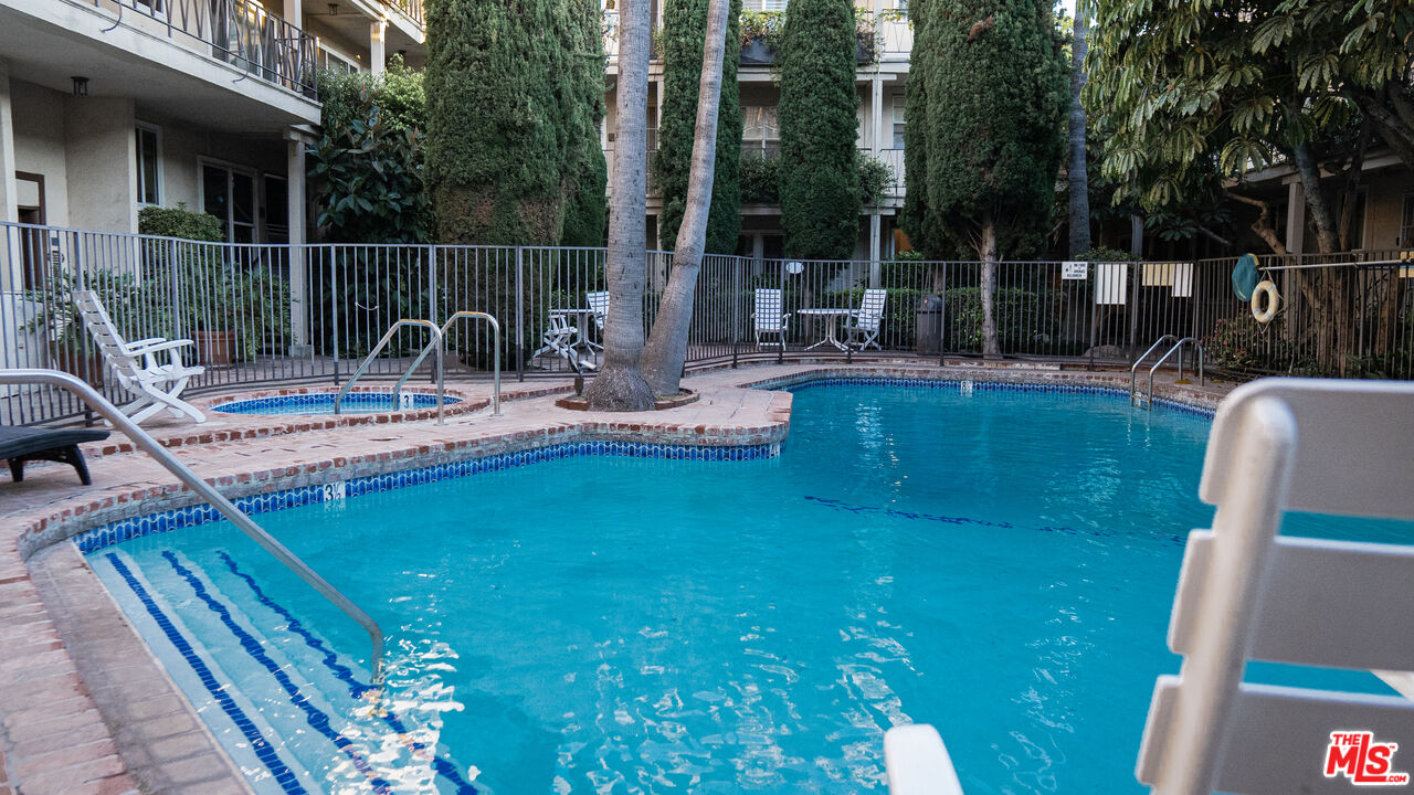 11670 Sunset Boulevard, Unit 104 Los Angeles, CA 90049 - Photo 11 of 11 a view of a house with backyard and sitting area