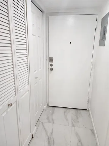 a view of a hallway with closet area