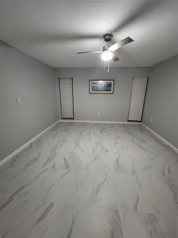 en empty room with windows